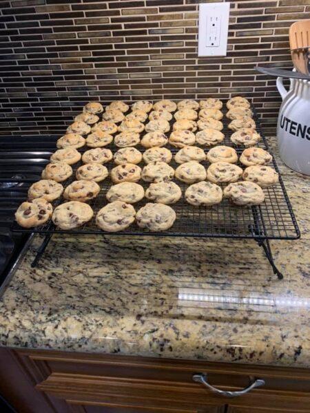 Cooling rack filled with 70 bite‑size half‑baked soft chocolate chip cookies on a granite countertop – soft chocolate chip cookies