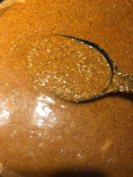 Hot dog chili sauce simmering on stove – homemade, classic drive-in style chili for hot dogs and hamburgers