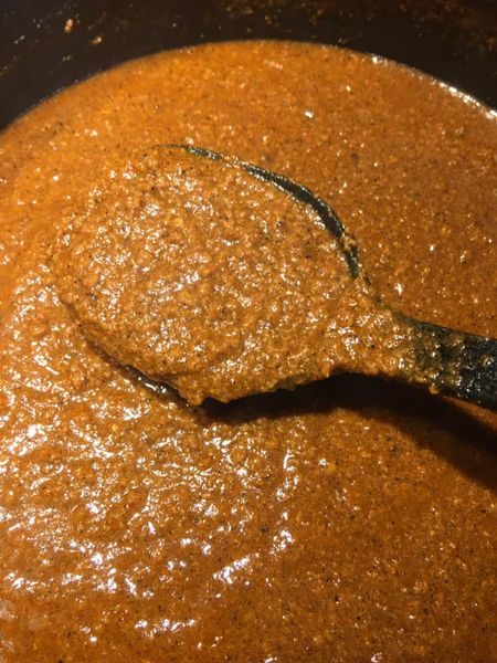 Homemade hot dog chili sauce simmering in a pot – thick, rich, old-fashioned chili sauce recipe