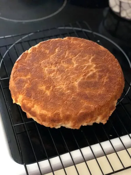 Biscuit bread baked in a cast iron skillet, golden brown crust.