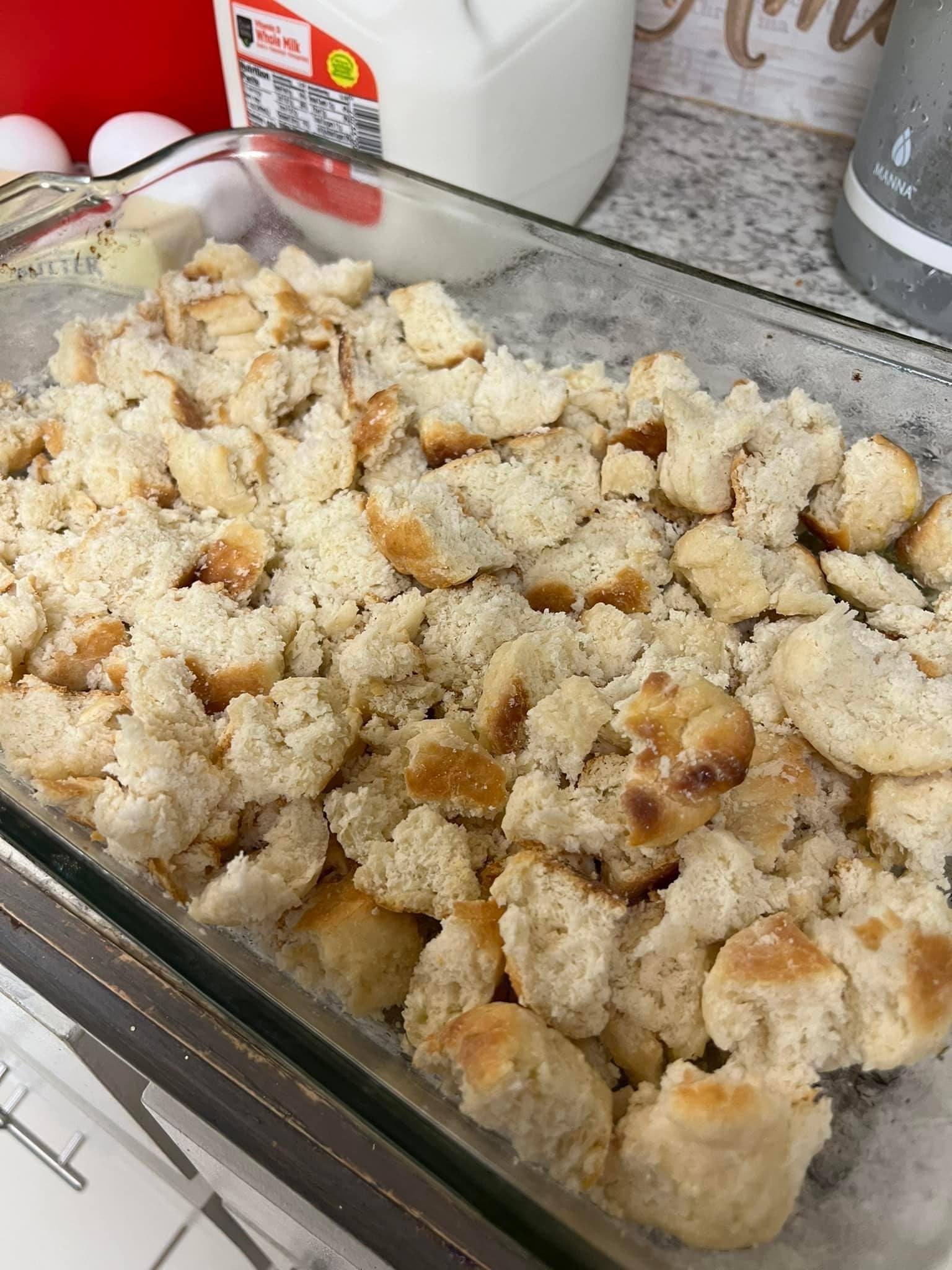 Place biscuit crumbles into the dish