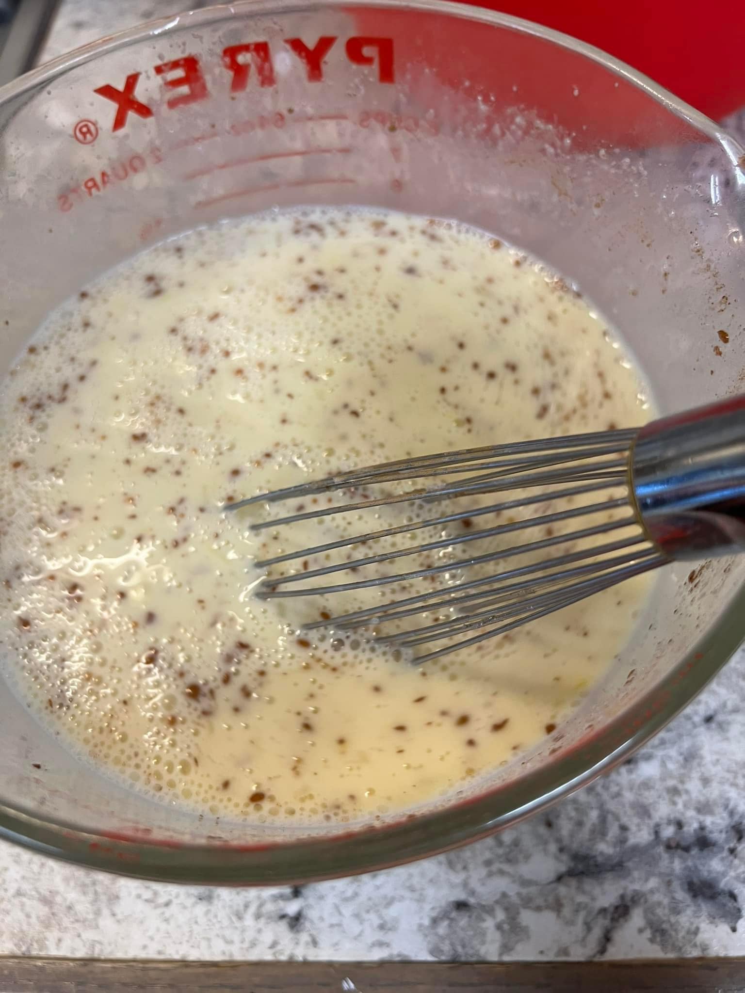 In a separate bowl, mix the milk, eggs, melted butter, vanilla, sugar, and cinnamon till well combined.