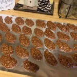 Old‑fashioned chocolate peanut butter oatmeal no‑bake cookies cooling on foil