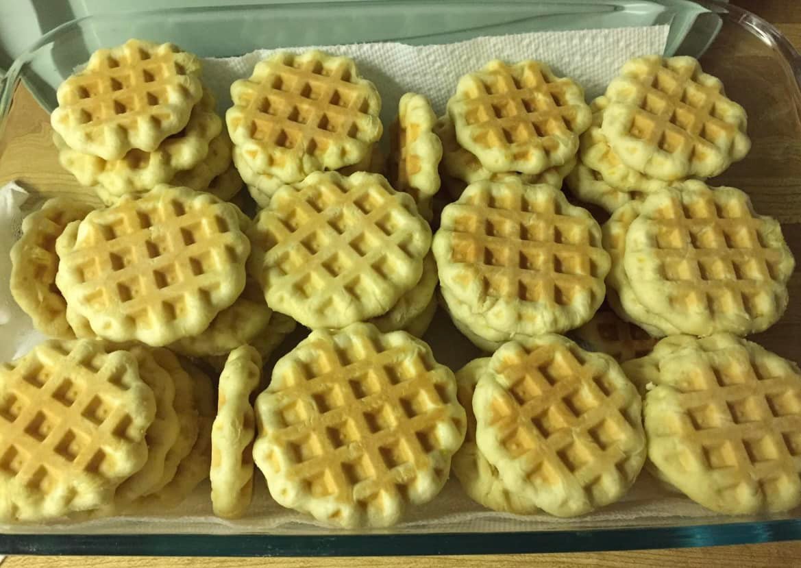 Freshly baked Grandma Cookies with a golden, pressed waffle design