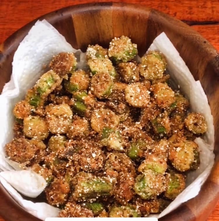 A serving dish of crispy fried okra, golden and ready to eat.