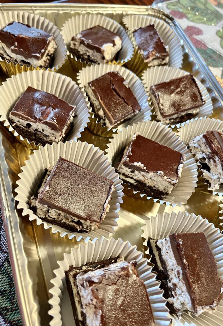 Oreo brownies with a fudgy brownie base, Oreo buttercream filling, and a shiny chocolate ganache topping