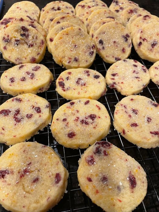 Cranberry Orange Shortbread cookies with coarse sugar and dried cranberries, fresh from the oven.