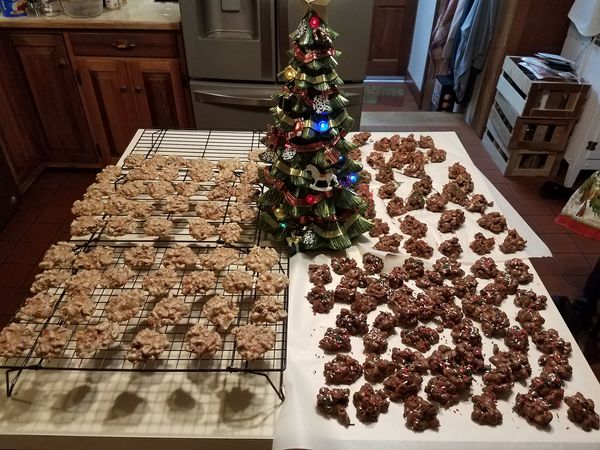 A holiday spread of fruit cake cookies displayed next to a decorated Christmas tree