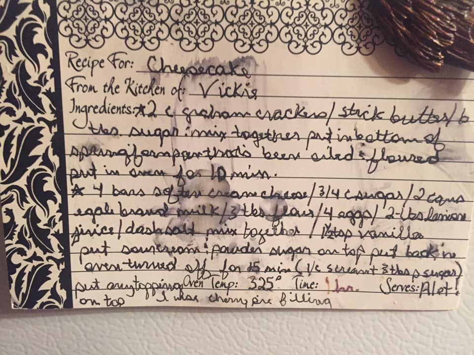 Handwritten cheesecake recipe card with ingredients and baking instructions