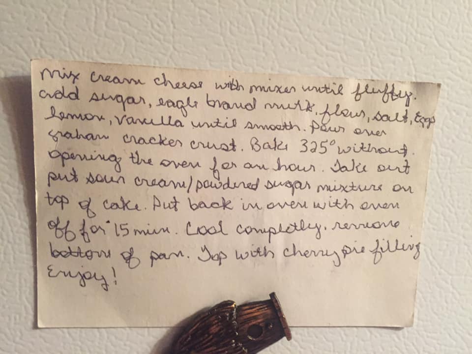 Handwritten cheesecake recipe card with ingredients and baking instructions