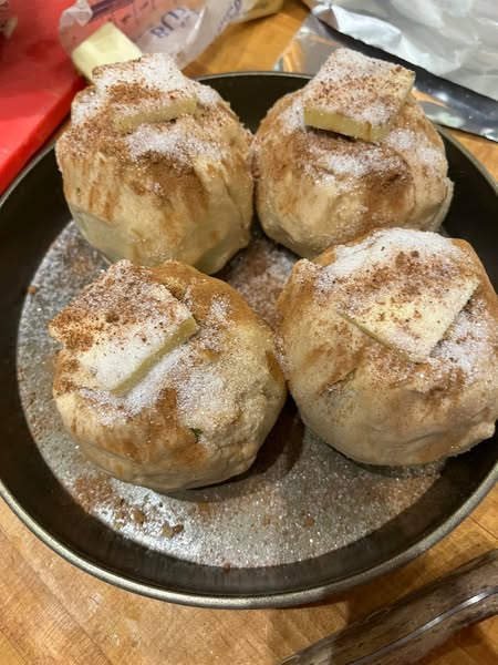 Apples filled with butter and brown sugar, sprinkled with cinnamon for a sweet filling