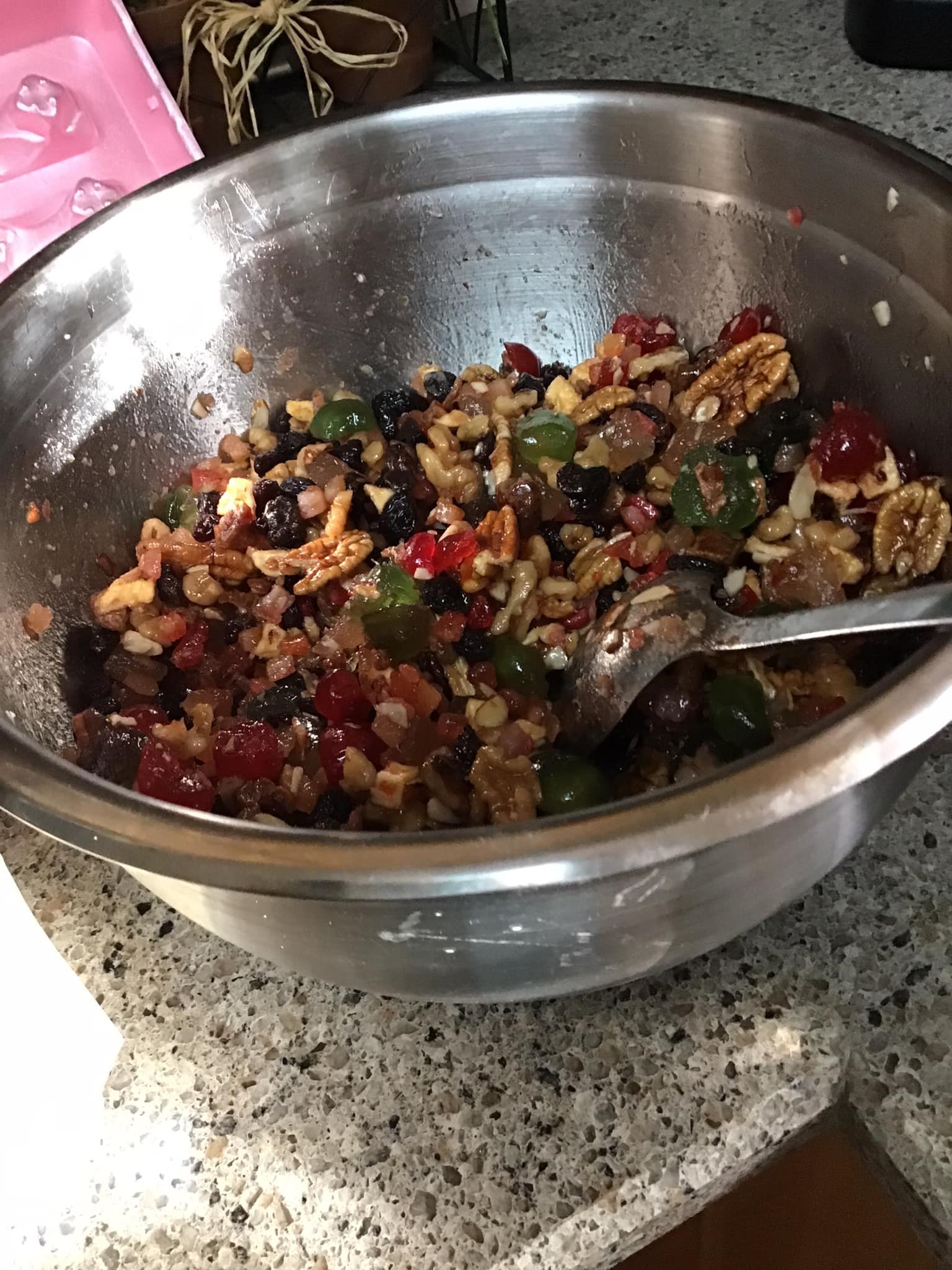 Mixed dried fruits and nuts soaking in bourbon for homemade fruitcake