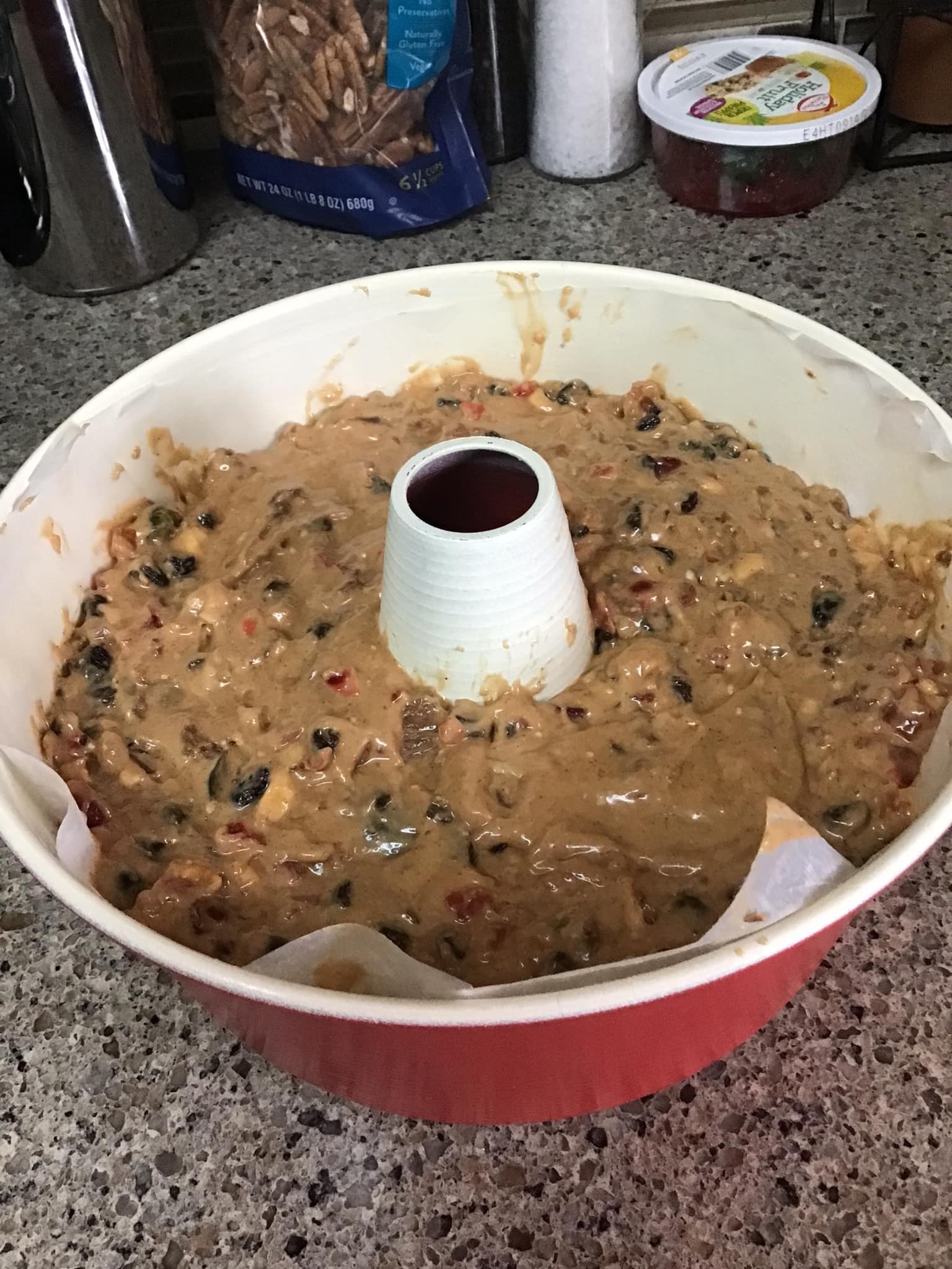 Freshly baked bourbon-soaked fruitcake in a loaf pan
