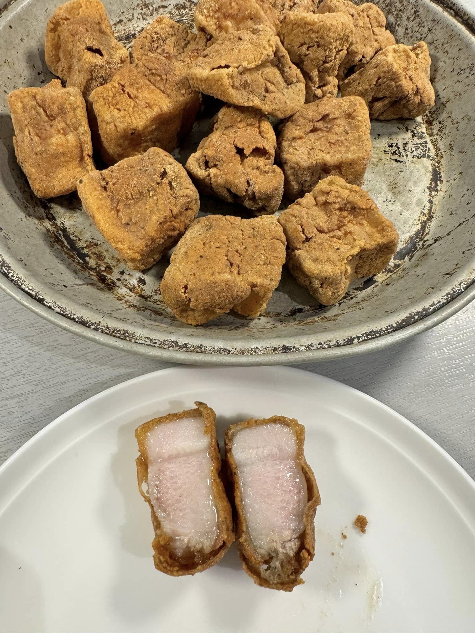Crispy fried pork belly served on a plate, golden and crunchy.