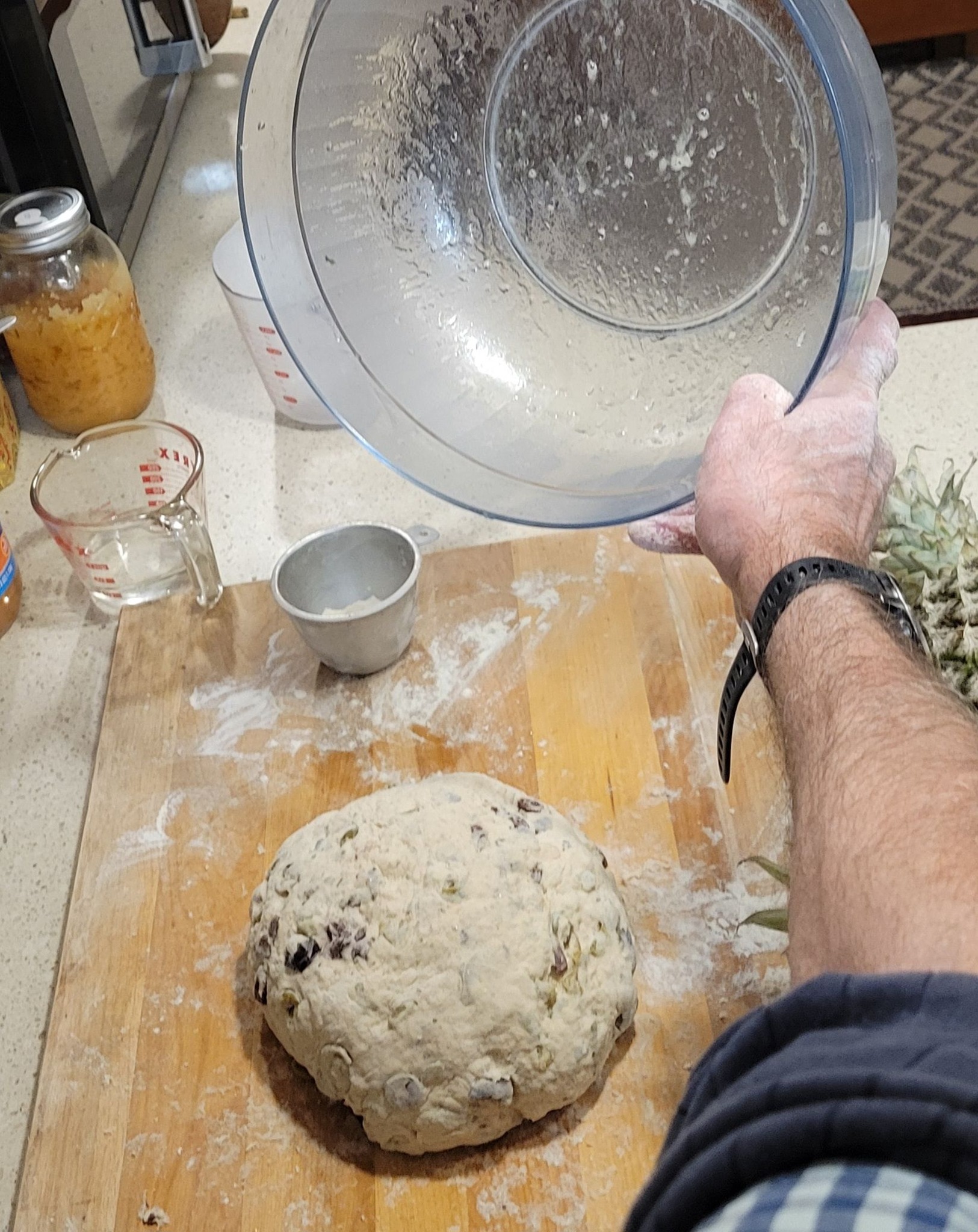 A well-kneaded dough ball resting in a bowl, coated lightly with olive oil.