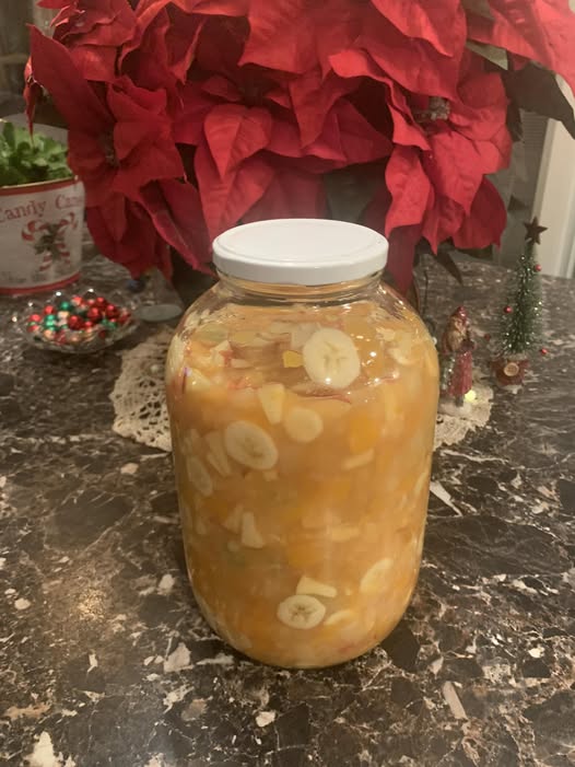 A glass jar filled with homemade Kentucky Christmas fruit salad