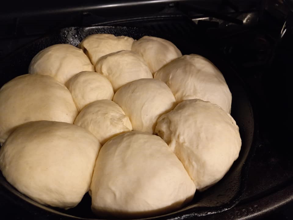 "Soft, pillowy dough ready for baking in a cast iron skillet