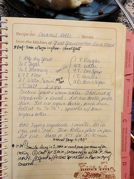 Great-Grandmother Vienna Mack's original caramel rolls recipe handwritten in a vintage cookbook.