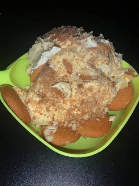 A serving of homemade banana pudding with vanilla wafers, ready to enjoy.