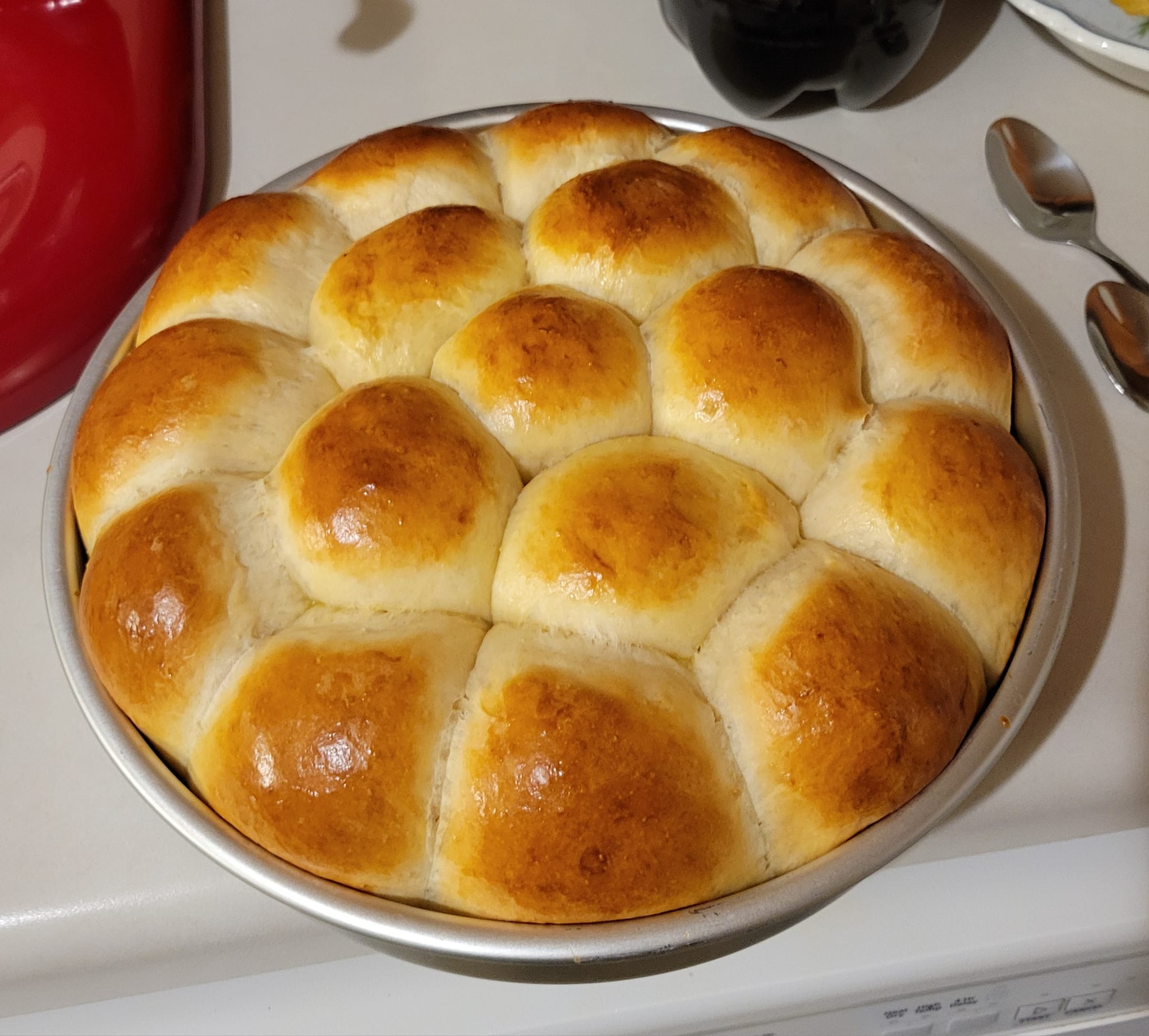 Freshly baked vintage dinner rolls in round pan, golden brown and fluffy