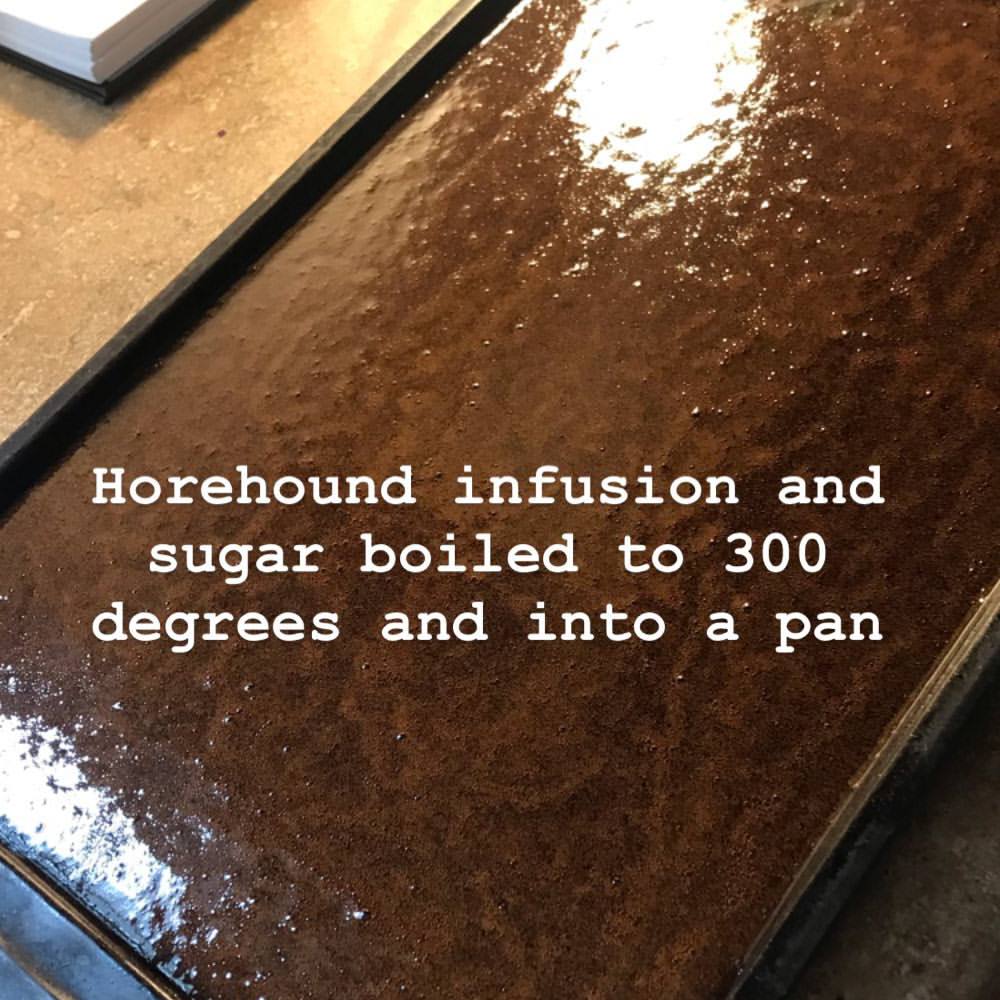Horehound sugar solution boiled to hard crack stage and poured into baking sheet to cool