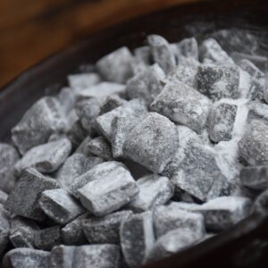 Finished horehound candy cut into square pieces and coated in powdered sugar”