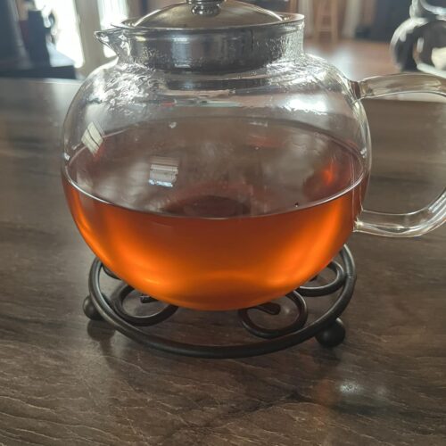Sassafras tea served in a rustic ceramic mug on a wooden table, evoking Appalachian tradition and natural remedies