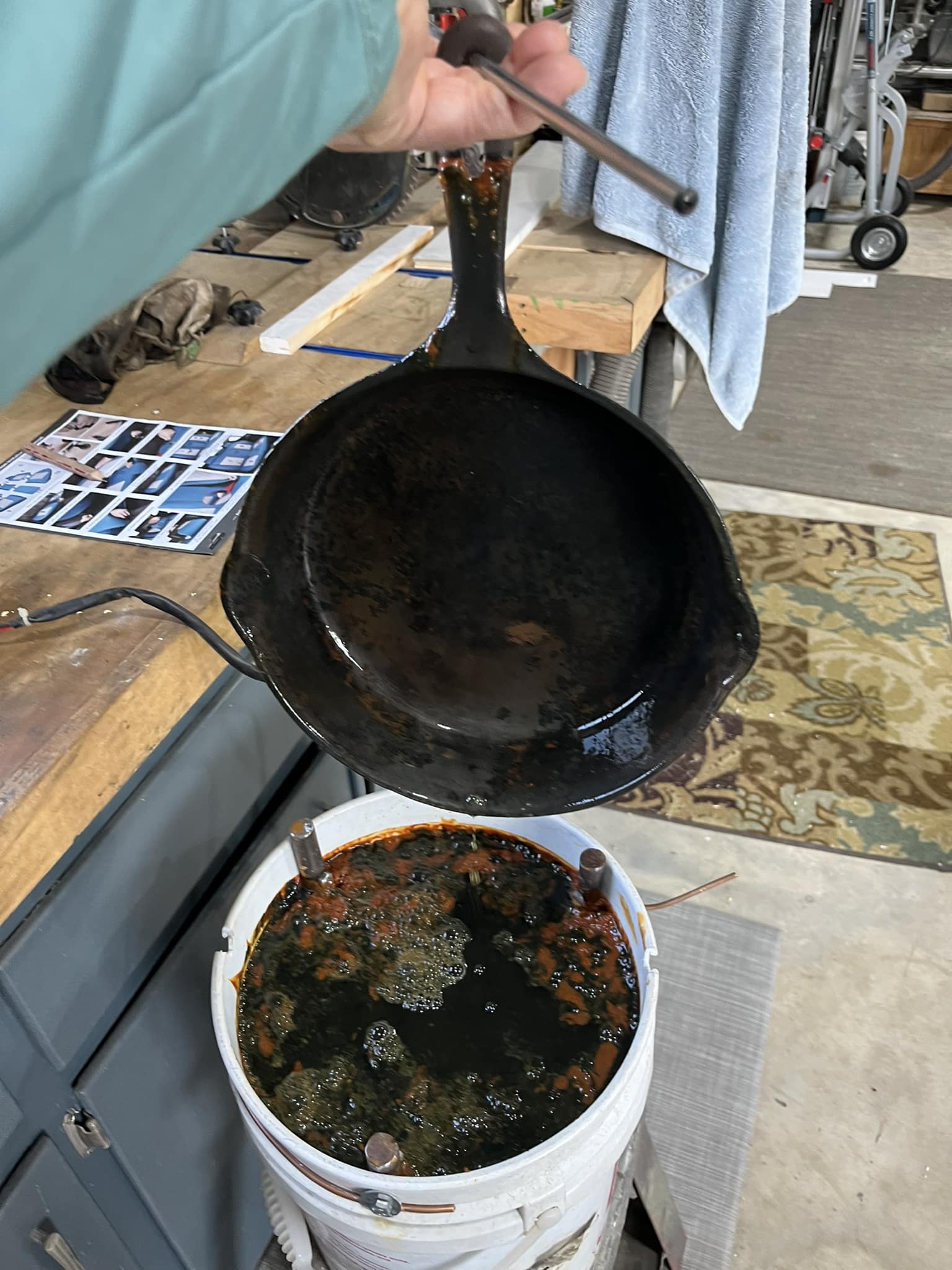 Thick orange-black sludge on the surface of electrolysis bath