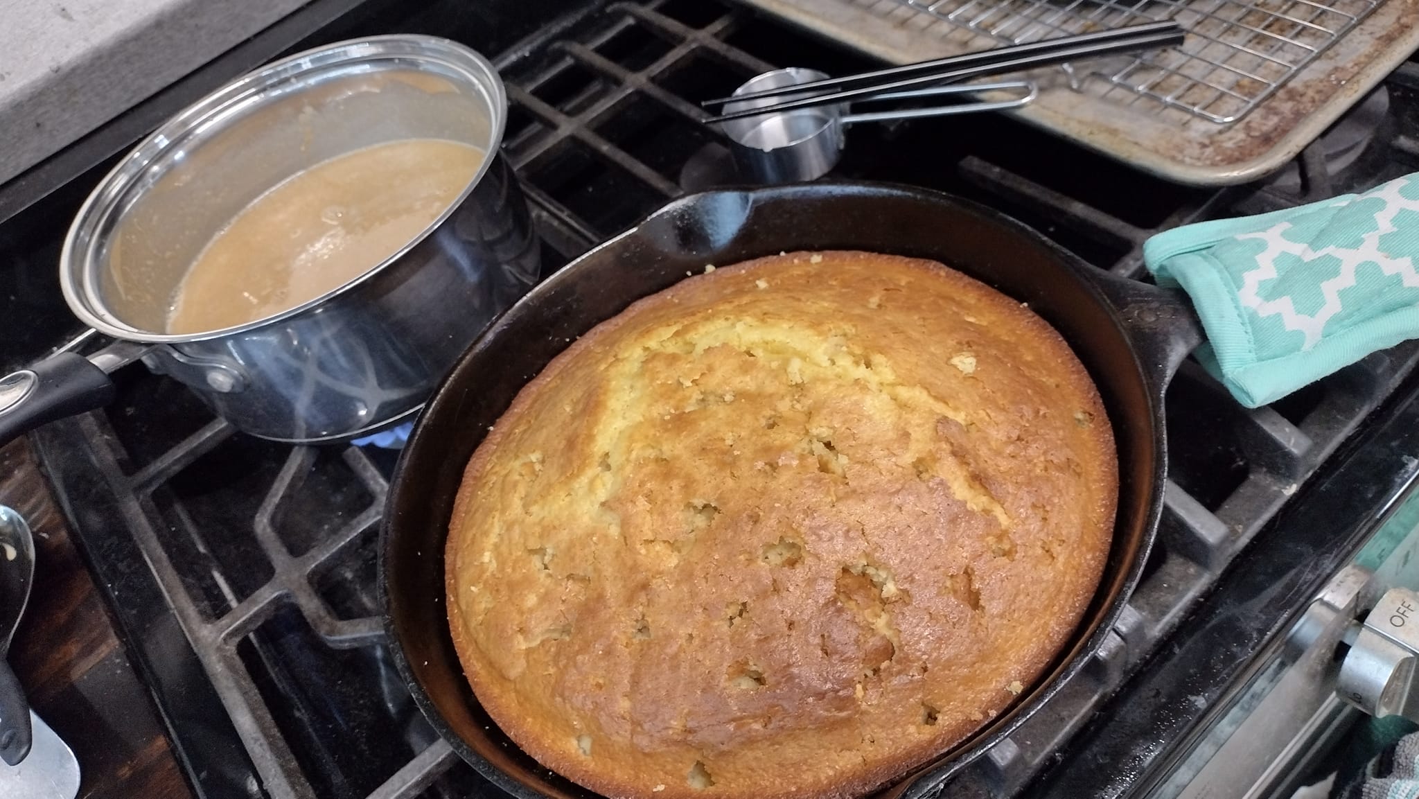 Freshly baked yellow cake in cast iron skillet.