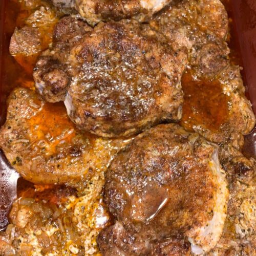 Pork chops covered in creamy pan gravy