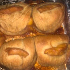 Golden baked peach biscuit turnovers