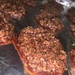 glossy no bake chocolate oatmeal cookies cooling on foil