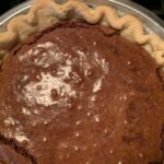 Freshly baked old-fashioned chocolate pie with glossy top