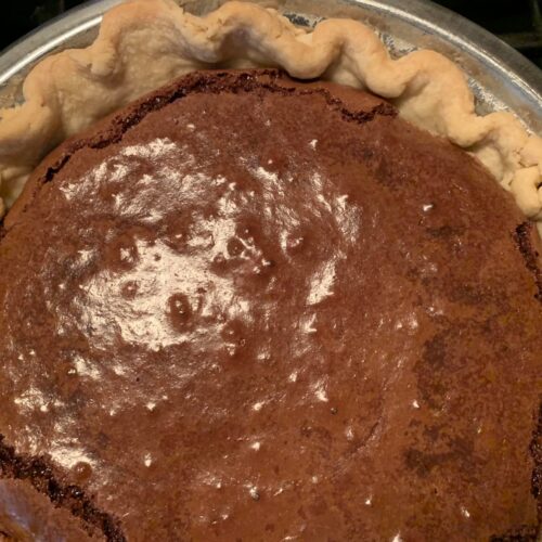 Freshly baked old-fashioned chocolate pie with glossy top