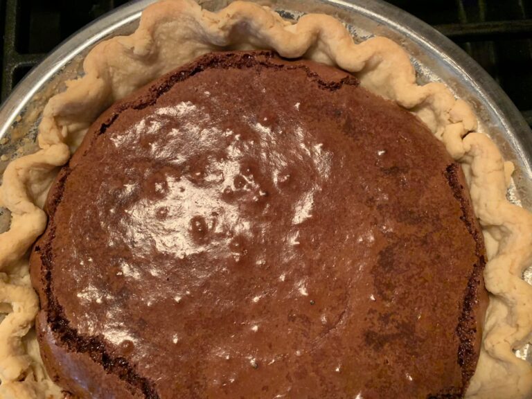 Freshly baked old-fashioned chocolate pie with glossy top