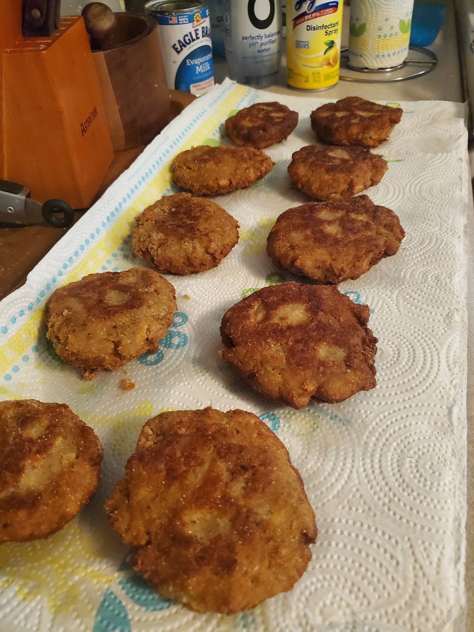 freshly fried southern salmon patties on paper towel