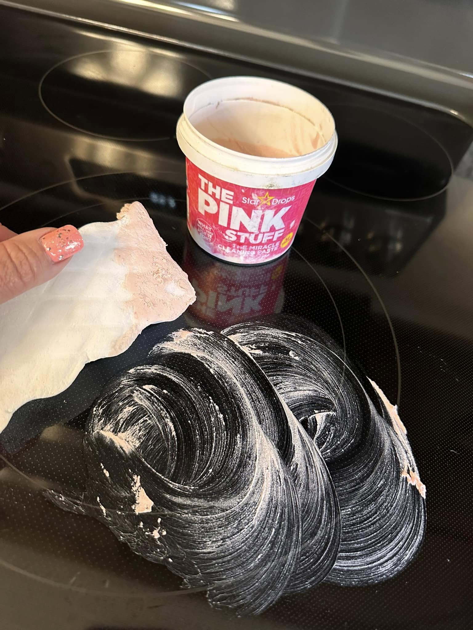 Cleaning paste and sponge used on glass stove top