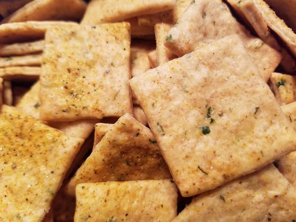 garlic herb sourdough discard crackers scored
