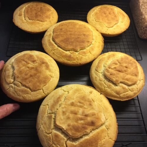 The finished cornbread, golden and glorious, still sitting in the cast iron skillet