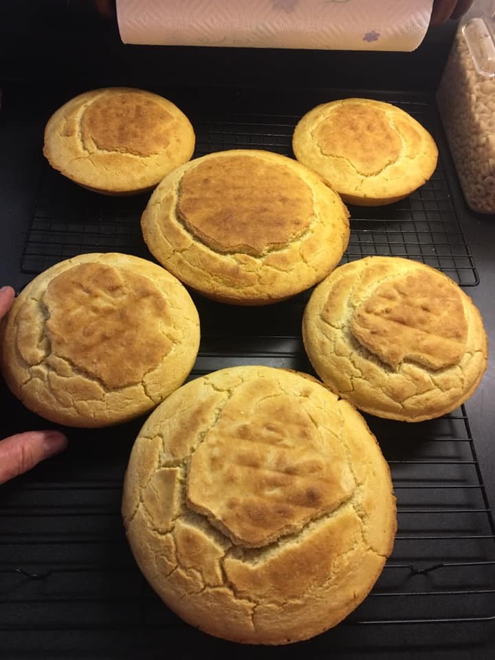 The finished cornbread, golden and glorious, still sitting in the cast iron skillet