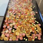 Colorful sausage‑potato stir fry ready to serve.