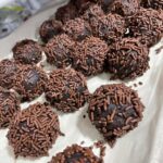 Sprinkle‑coated rum balls set on tray