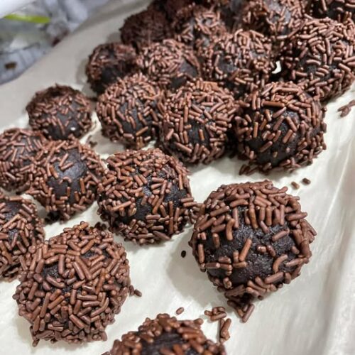 Sprinkle‑coated rum balls set on tray