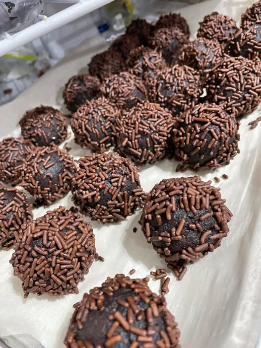 Sprinkle‑coated rum balls set on tray