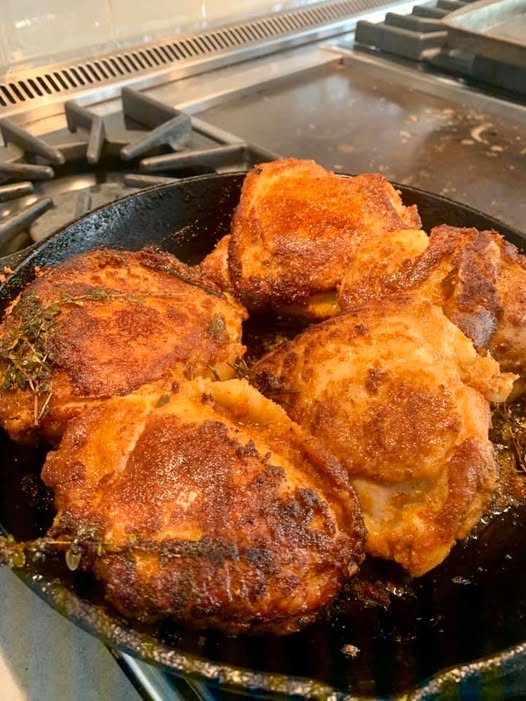 Cast iron chicken thighs searing skin down – golden brown
