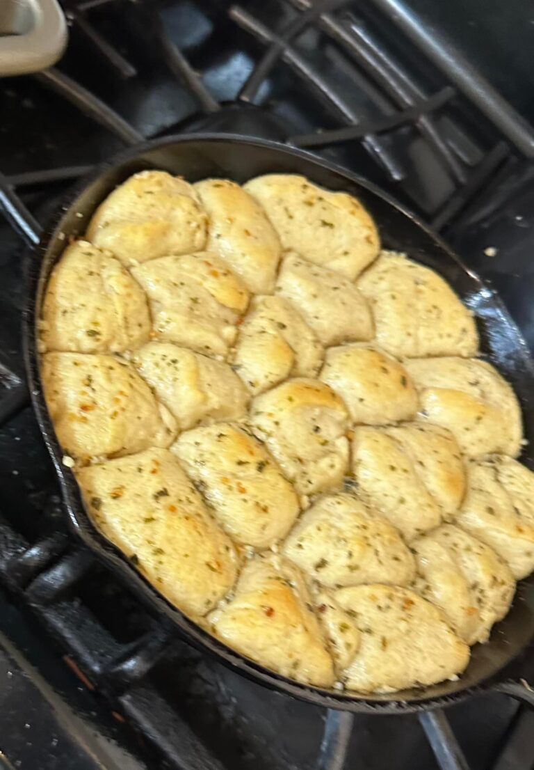 pull apart garlic knots baked golden brown in cast iron skillet