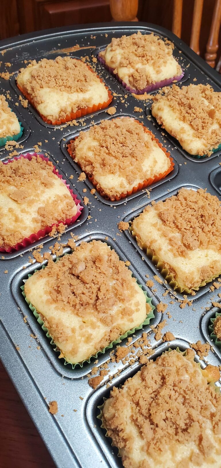 Brownie pan lined with colorful cupcake liners ready for batter
