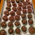 Crockpot Christmas crack candies topped with festive red, green, and white sprinkles