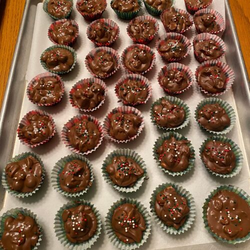 Crockpot Christmas crack candies topped with festive red, green, and white sprinkles