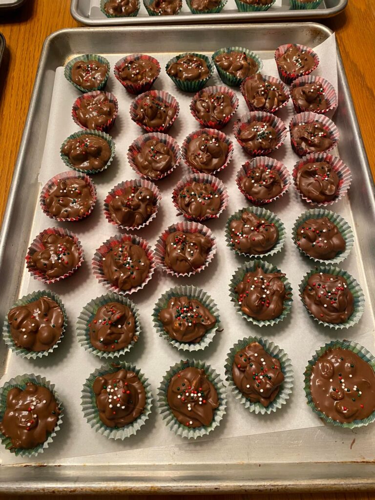 Crockpot Christmas crack candies topped with festive red, green, and white sprinkles
